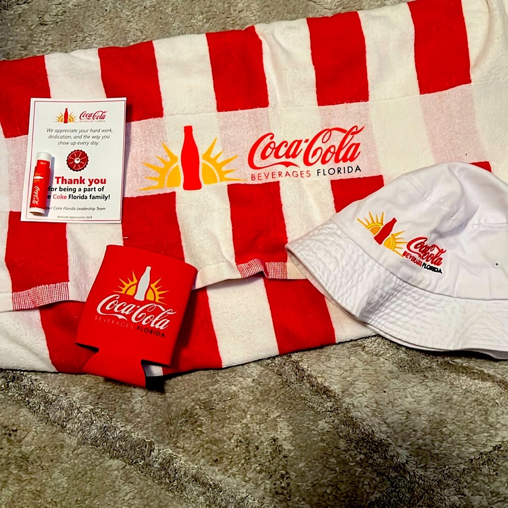 Coca Cola leader pack… chapstick beer coozy, bucket hat and beach towel